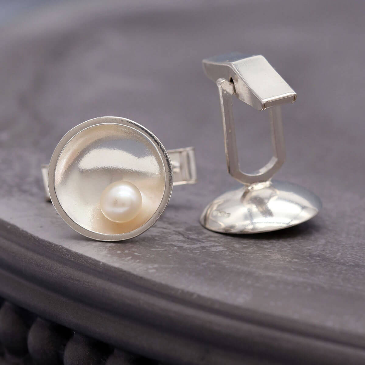 Sterling silver pearl cufflinks handcrafted with genuine freshwater pearls and traditional silversmithing techniques.