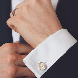 Handmade freshwater pearl cufflinks styled on a white shirt cuff, highlighting the elegant double-sided chain design.