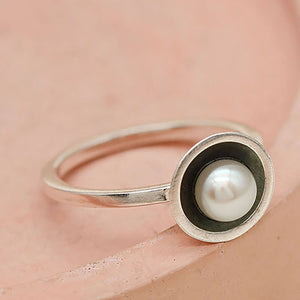Side profile of an oxidised silver pearl ring handcrafted in sterling silver