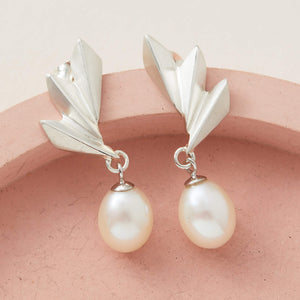 Front view of sterling silver drop pearl earrings with sculptural fan design, stylish Art Deco jewellery gift for her.
