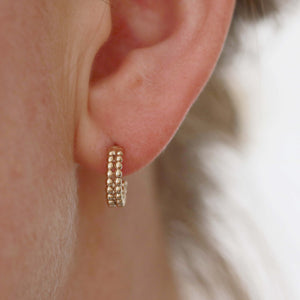 solid gold huggie hoop earrings