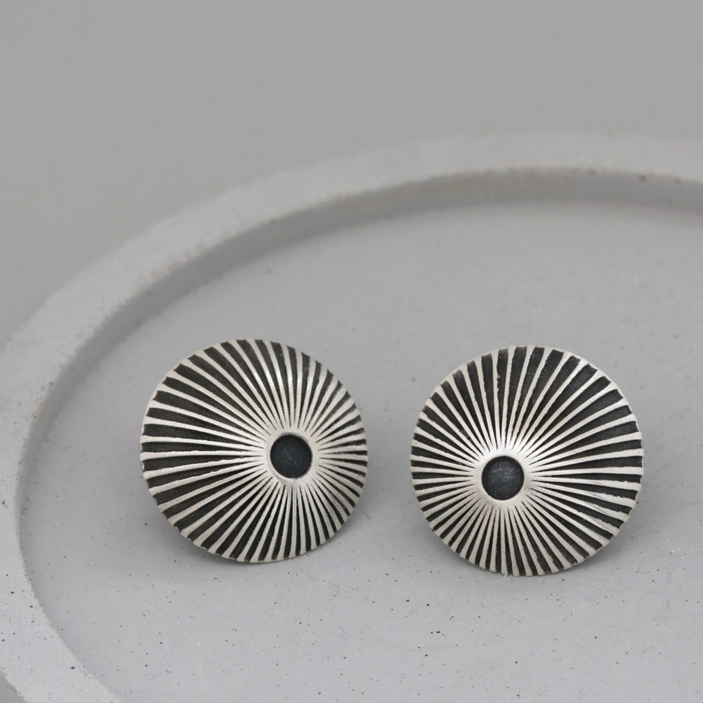 silver and black starburst earrings