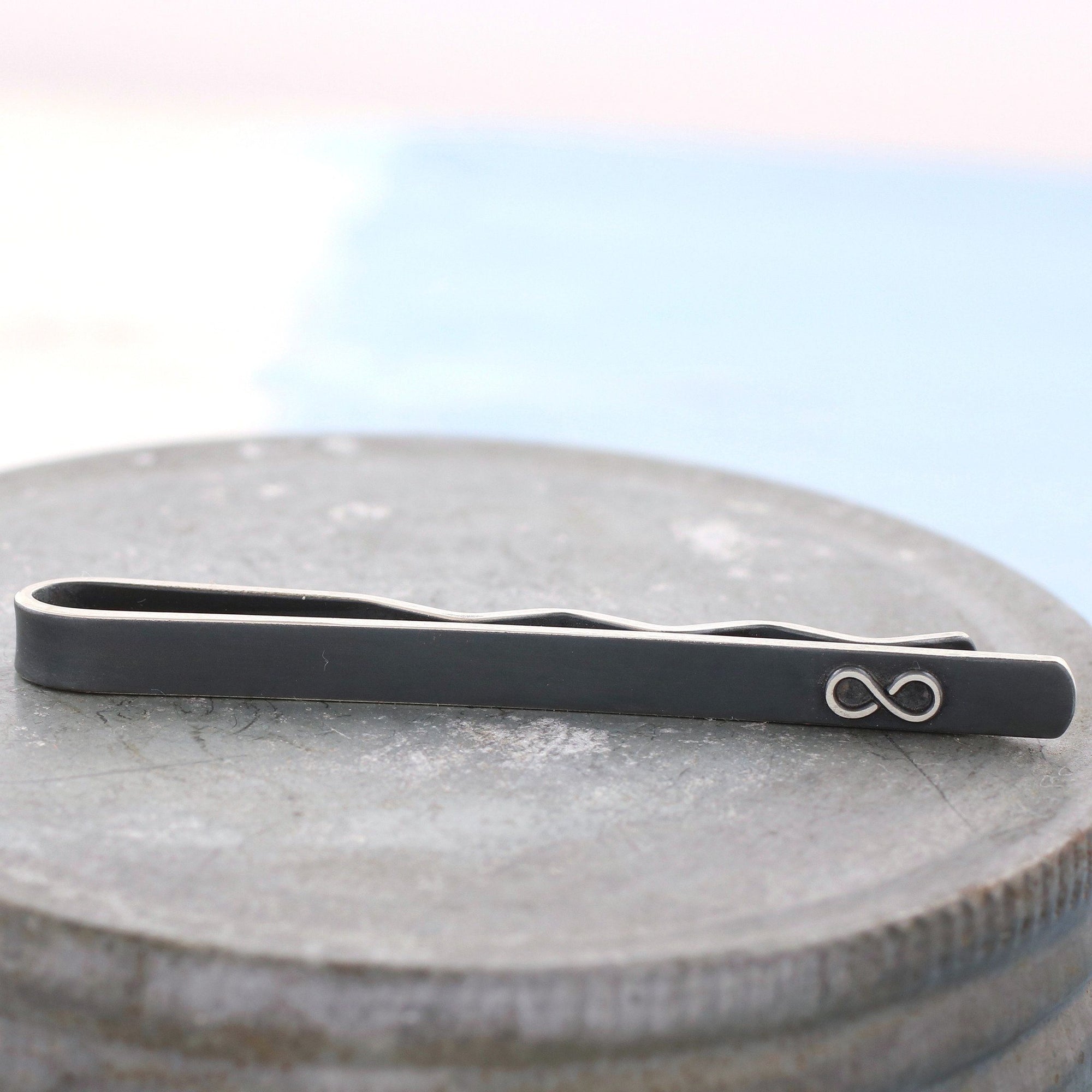 black and silver infinity tie clip