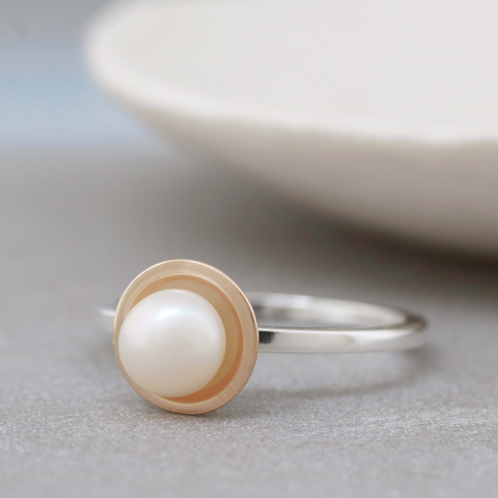 delicate silver and gold pearl ring