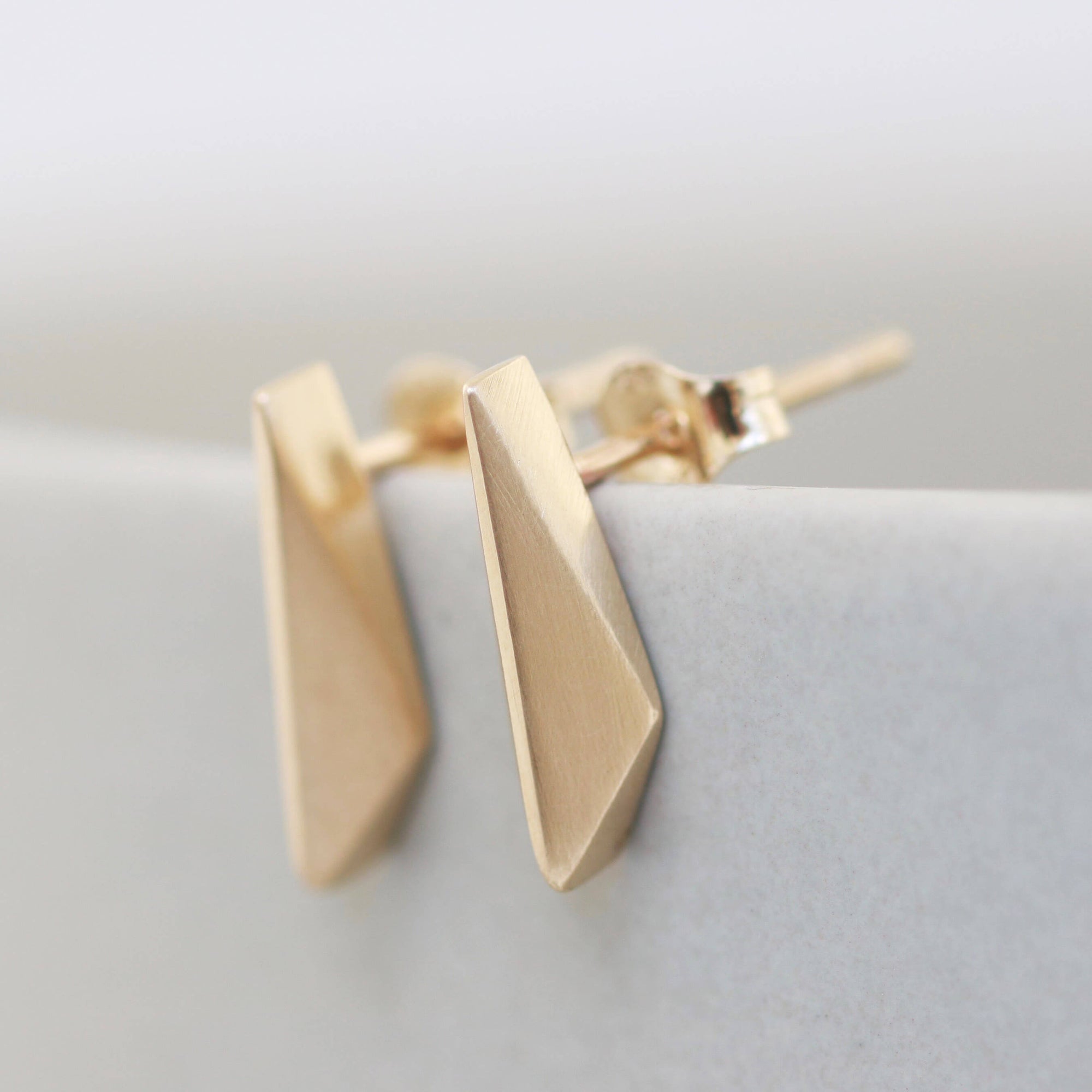 faceted gold earrings