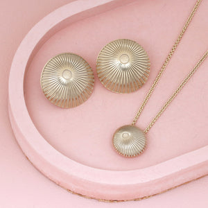 Simple gold pendant necklace with matching earrings