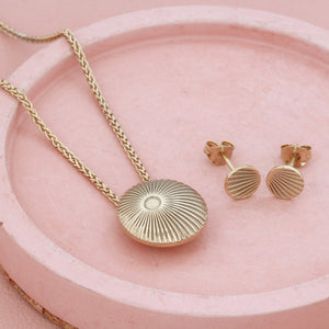 Small gold pendant necklace with matching earrings