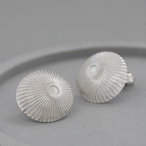 simple silver earrings with precise art deco pattern