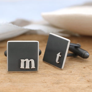 silver and black monogram cufflinks
