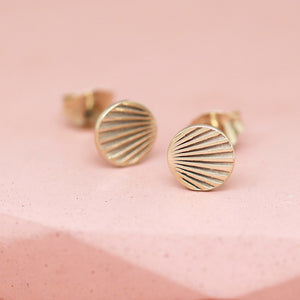 Tiny gold stud earrings